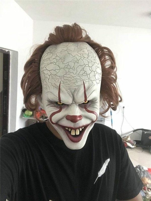 A man wearing Pennywise mask