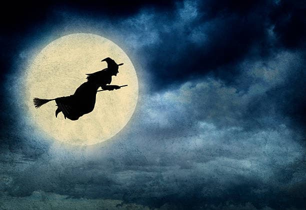 a witch flying on her broom